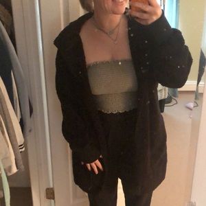 Opened and oversized fuzzy bear hoodie